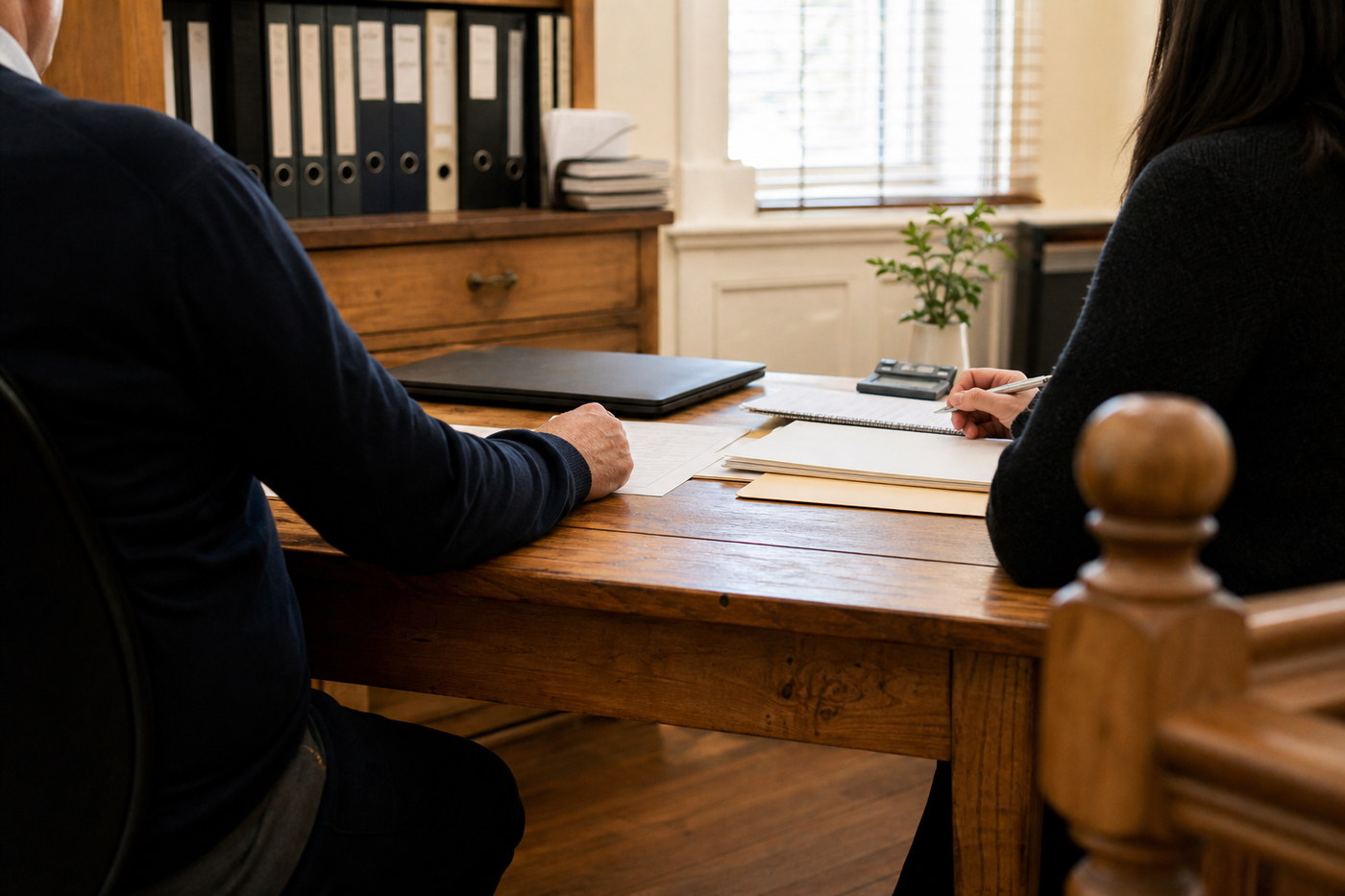 A quiet accounting consultation at a desk